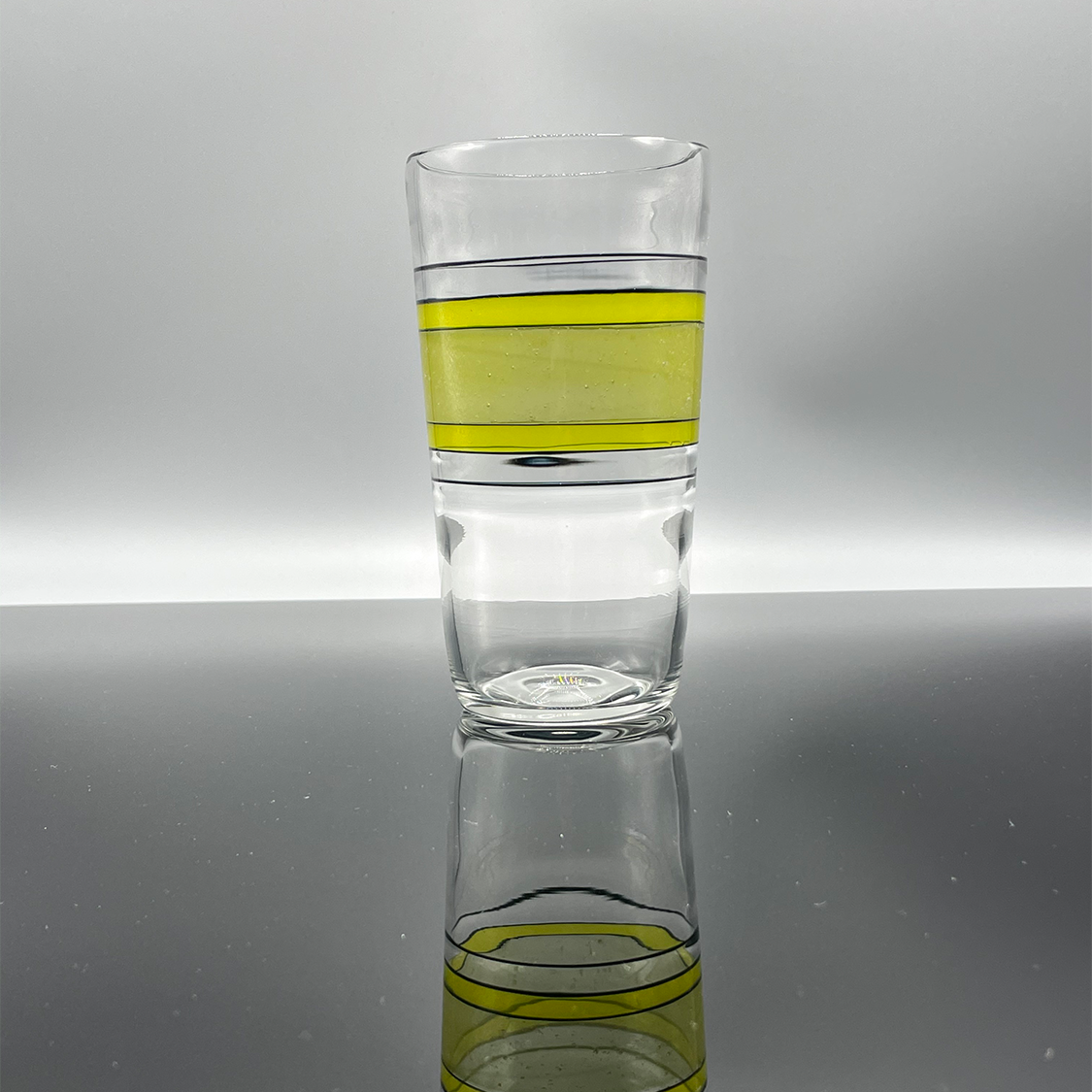 Oregon Duck themed beer glass with yellow, green and black accents.