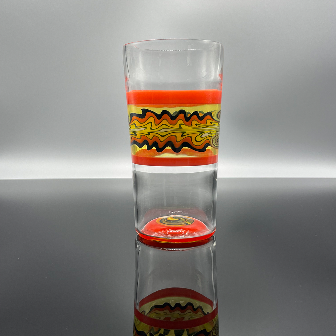 Fire themed beer glass with multiple sections of colored borosilicate glass.